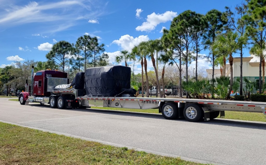 Pedowitz Machinery Movers Carolina CNC Lathe Trucking and Rigging Jupiter Florida to California 1